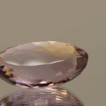 Natural oval cut ametrine gemstone with purple yellow color, 20.50 × 13.30 mm