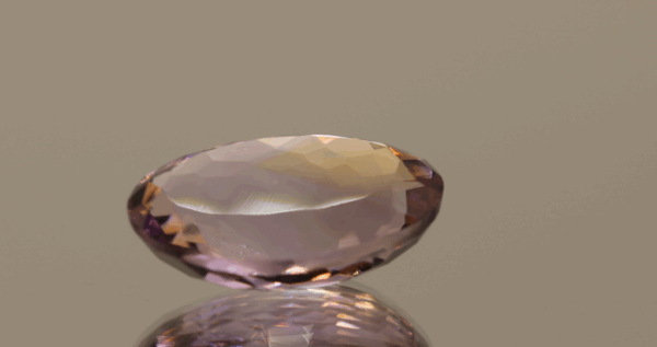 Natural oval cut ametrine gemstone with purple yellow color, 20.50 × 13.30 mm