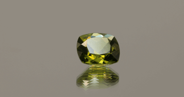 Natural 2.73 ct peridot in cushion cut, yellowish green color, untreated, GIA certified, dimensions 9.01 × 8.89 × 4.76 mm, loose gemstone for fine jewelry.