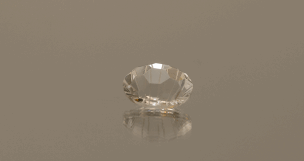 Faceted Topaz gemstone, colorless, oval cut, 3.78 carats, high clarity, ideal for fine jewelry.