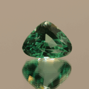 Light green trillion-shaped spodumene, 9.25 carat, 14 × 6.5 × 9.6 mm, no treatment, unknown origin.