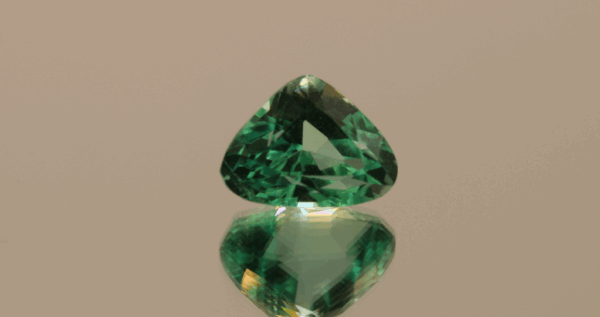 Light green trillion-shaped spodumene, 9.25 carat, 14 × 6.5 × 9.6 mm, no treatment, unknown origin.
