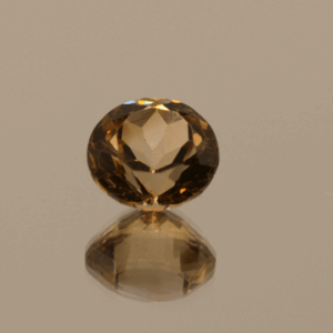 Light brown round-shaped topaz, 4.76 carat, 10 × 10 × 6.8 mm, no treatment, unknown origin.