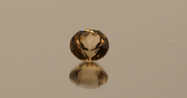 Light brown round-shaped topaz, 4.76 carat, 10 × 10 × 6.8 mm, no treatment, unknown origin.