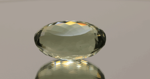 Natural prasiolite gemstone, 27.44 carat, oval cut, pale green color, untreated, loose gemstone, dimensions 23 × 14.1 × 13 mm, ideal for fine jewelry.