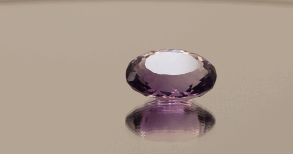 Natural oval cut amethyst gemstone with purple violet color, 15.70 × 11.30 mm