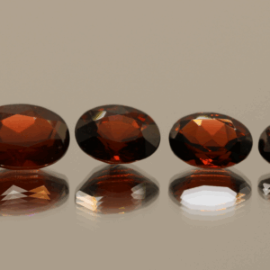 Set of 4 natural spessartite garnets, 7.09 carats total, oval cut, orange-red color, untreated