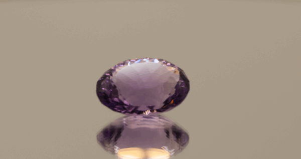 Natural oval cut amethyst gemstone with purple violet color, 14.70 × 12.10 mm