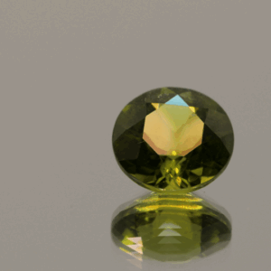 Natural 2.87 carat peridot, round cut, yellowish green color, untreated, GIA certified, loose gemstone, dimensions 9.01 × 9.13 × 5.34 mm, perfect for fine jewelry.