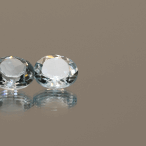 Set of 2 light blue round-shaped topaz, total 3.57 carat, 7.9 × 7.6 × 3.7–3.9 mm, no treatment, unknown origin.