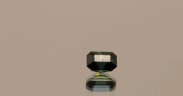 Natural sapphire gemstone, 0.92 carat, octagon cut, indigo blue color, unheated, loose gemstone, dimensions 5.83 × 4.14 × 3.97 mm, origin Madagascar, AIG certified.