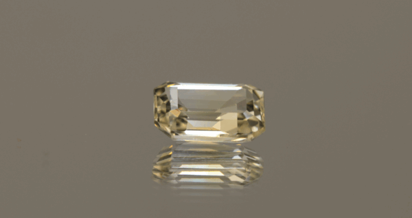 Natural yellow sapphire gemstone, 2.57 carat, octagon cut, yellow color, unheated, loose gemstone, dimensions 9 × 6.83 × 3.55 mm, origin Madagascar, AIG certified.