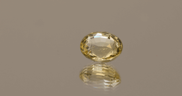 Yellow Sri Lanka sapphire 2.1 carat oval cut, untreated, Sri Lanka origin, dimensions 7.95 × 6.67 × 4.4 mm, GFCO certified.
