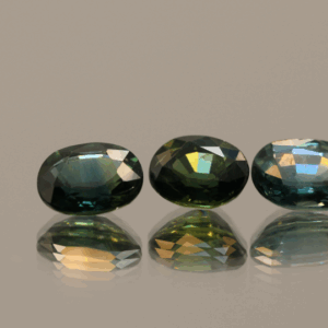 Set of three green-blue sapphires 2.83 carat total, oval cut, heat-treated, Madagascar Sapphire origin, dimensions 7.09 × 5.15 × 3.01 mm, GFCO certified.