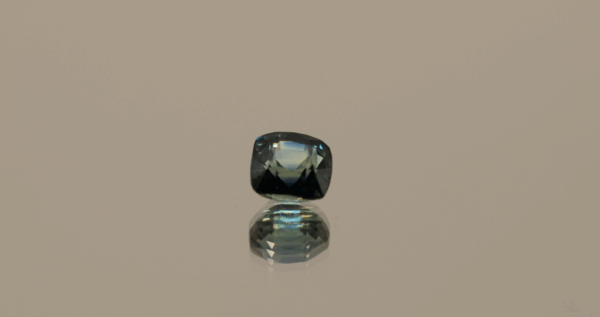 Natural sapphire gemstone, 0.9 carat, cushion cut, blue color, unheated, loose gemstone, dimensions 5.08 × 5.08 × 3.69 mm, origin Madagascar, GFCO certified.