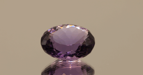 Natural oval cut amethyst gemstone with purple violet color, 13.70 × 10.10 mm