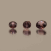 Set of 3 round purple sapphires, untreated, Madagascar origin, total 0.87 carat, dimensions 4.36 × 4.3 × 2.95 mm, AIG certified.