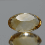 Natural oval cut citrine gemstone with yellow-orange color, 18.60 × 13.50 mm