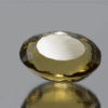 Natural oval cut citrine gemstone with yellow-orange color, 18.80 × 14.80 mm