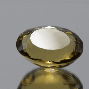 Natural oval cut citrine gemstone with yellow-orange color, 18.80 × 14.80 mm