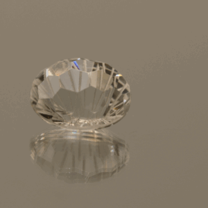 Colorless oval-shaped topaz, 6.74 carat, 12.2 × 9.6 × 7.6 mm, no treatment, unknown origin.