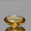 Natural oval cut citrine gemstone with yellow-orange color, 16.70 × 12.50 mm