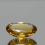 Natural oval cut citrine gemstone with yellow-orange color, 16.70 × 12.50 mm