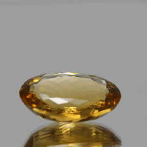 Natural oval cut citrine gemstone with yellow-orange color, 16.70 × 12.50 mm