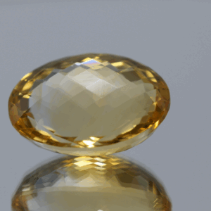 Natural oval cut citrine gemstone with yellow-orange color, 19.20 × 14.30 mm