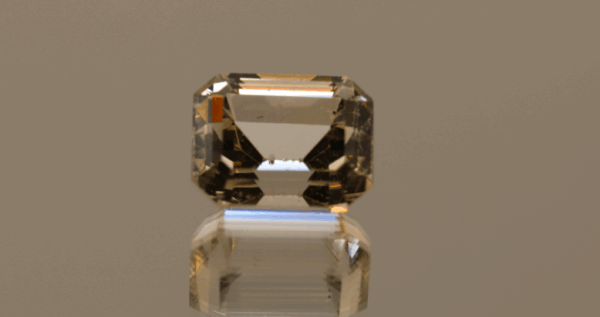 Light brown octagon-shaped topaz, 14.07 carat, 13.8 × 11.1 × 9.5 mm, no treatment, unknown origin.