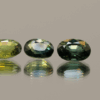 Set of three green oval sapphires, heat-treated, Madagascar origin, total 2.86 carat, dimensions 7.13 × 5.09 × 3.04 mm, GFCO certified.