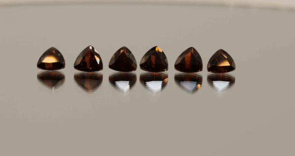 Natural almandine garnets, 5.5 carats total, trillion cut, purple-red color, untreated, set of 6