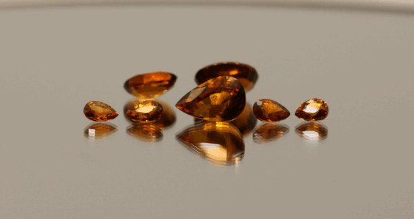 Natural hessonite garnet gemstones 8.7 carats mixed cuts orange color untreated loose stones set