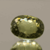 natural IGI paraiba tourmaline gemstone 12.27 carat yellow green oval cut 15.05x11.98x9.28 mm heat treated IGI certified