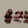 Natural rhodolite garnet gemstones 7.28 carats mixed cuts purple color untreated loose stones set