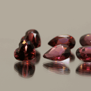 Natural rhodolite garnet gemstones 7.28 carats mixed cuts purple color untreated loose stones set