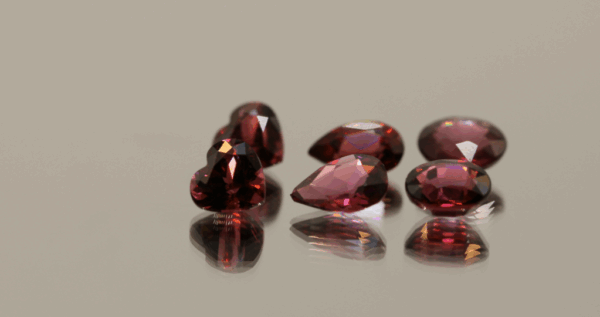 Natural rhodolite garnet gemstones 7.28 carats mixed cuts purple color untreated loose stones set
