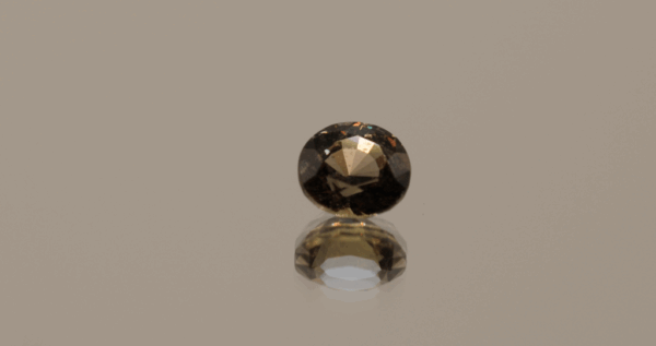 Brownish orange padparadscha sapphire round, 1.08 carat, 5.85 × 5.68 × 3.93 mm, Madagascar origin, GFCO certified.