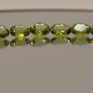 Natural peridot set, total weight 24.3 carat (18 stones), oval cut, yellow green color, untreated, loose gemstones, dimensions 6.9–8.9 × 4.3–6.8 × 2.6–4.5 mm, perfect for fine jewelry.