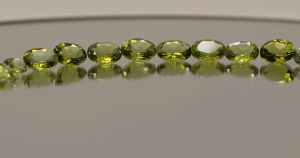 Natural peridot set, total weight 24.3 carat (18 stones), oval cut, yellow green color, untreated, loose gemstones, dimensions 6.9–8.9 × 4.3–6.8 × 2.6–4.5 mm, perfect for fine jewelry.