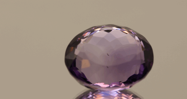 Natural oval cut amethyst gemstone with purple violet color, 15.90 × 15.00 mm