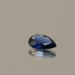 Royal blue pear-shaped sapphire, 0.55 carat, 7.05 × 5.00 × 2.00 mm, heat-treated, Madagascar origin, IGS certified.