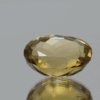 Natural oval cut citrine gemstone with yellow-orange color, 16.80 × 13.10 mm