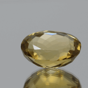 Natural oval cut citrine gemstone with yellow-orange color, 16.80 × 13.10 mm
