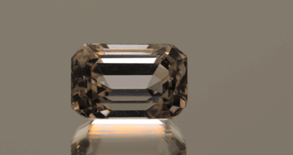 Light yellow octagon-shaped spodumene, 12.14 carat, 14.5 × 9.91 × 9.4 mm, no treatment, unknown origin, HGTL certified.