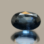Vivid blue sapphire, oval, heat-treated, Madagascar origin, 4.69 carat, dimensions 11.71 × 8.37 × 5.44 mm, AIG certified.