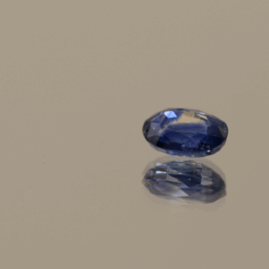 Natural sapphire gemstone, 0.77 carat, oval cut, blue color, heat-treated, loose gemstone, dimensions 6.22 × 4.34 × 2.81 mm, origin unknown, AIG certified.