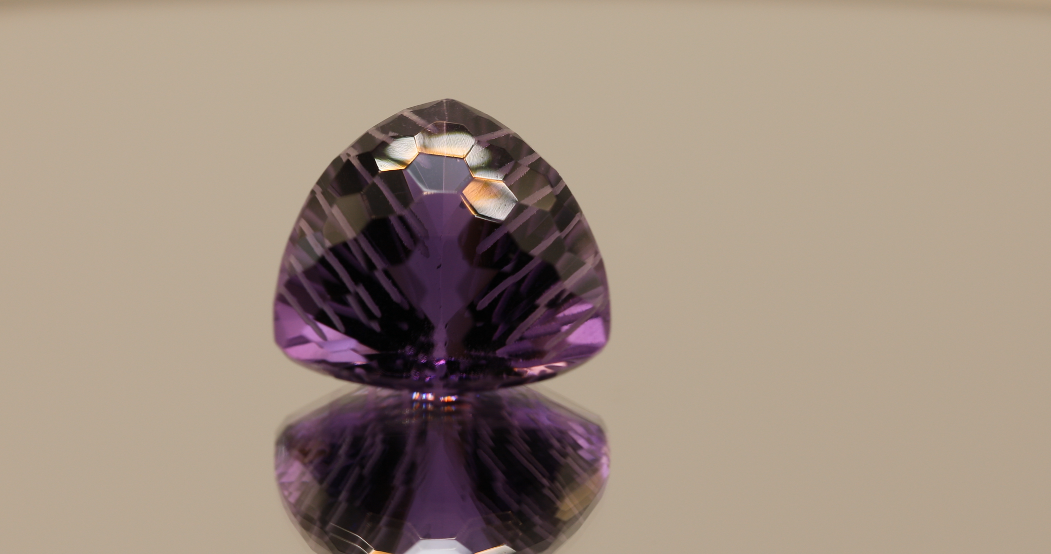Natural trillion cut amethyst gemstone with purple violet color, 16.30 × 15.80 mm