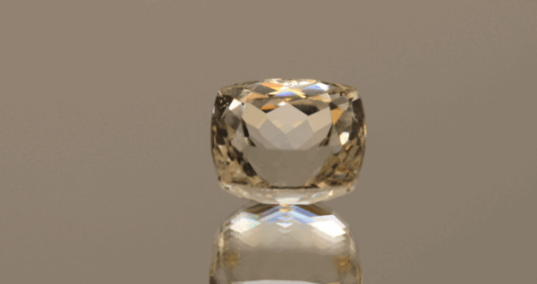 Light yellow square cushion-shaped spodumene, 12.35 carat, 13 × 10.6 × 10.1 mm, no treatment, unknown origin.