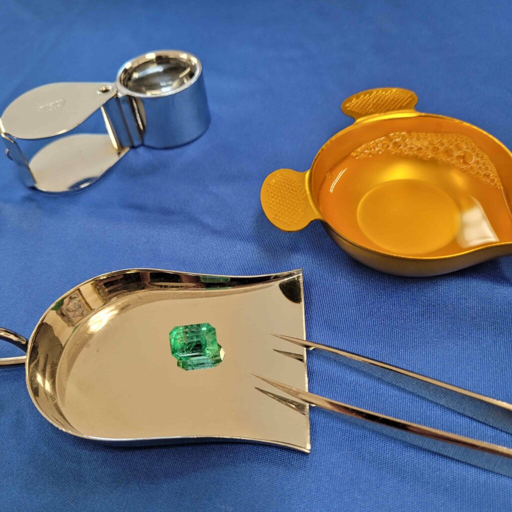 Loose gemstone prepared for professional cleaning and gem care before polishing and inspection